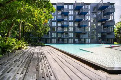 a swimming pool with a building in the background at \u82ad\u4e1cThe DECK 6\u516c\u5bd3 \u8fd1\u82ad\u4e1c\u6d77\u6ee9BANGLA\u6c5f\u897f\u51b7 in Patong Beach