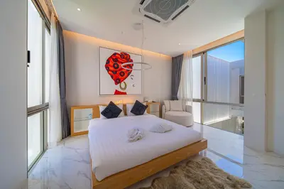 a bedroom with a large bed and a large window at The Residence Tropical 3BR Villa with Private Pool in Ban Pak Lak