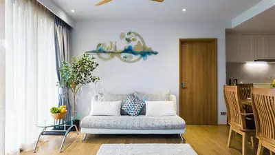 a living room with a couch and a table at Beachside Residence 4 floor, Seaside, 250m to the beach in Bang Tao Beach