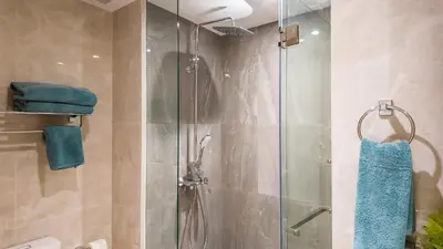 a shower with a glass door in a bathroom at Beachside Residence 4 floor, Seaside, 250m to the beach in Bang Tao Beach