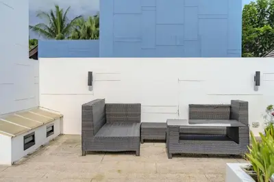 two wicker chairs and a table on a patio at Wings Elegant 2BR Villa Bang Tao Beach in Laguna Phuket