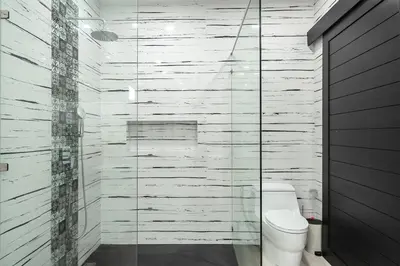 a bathroom with a toilet and a glass shower at V204 Tropical Score 3BR with Pool, Tub & Snooker in Rawai Beach