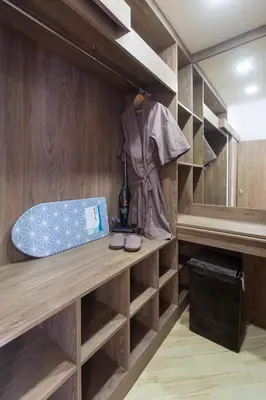 a walk in closet with a bed and a shelf at Calipso Garden 304 in Rawai Beach