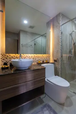 a bathroom with a sink and a toilet and a shower at Calipso Garden 304 in Rawai Beach