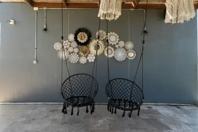 two chairs sitting in a room with chandeliers at Calipso Garden 312 in Rawai Beach