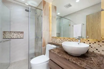 a bathroom with a sink and a toilet and a shower at Calipso Garden 312 in Rawai Beach