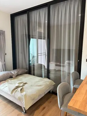 a bedroom with a bed and a large window at JU3 Halo NEW ВатСaп66935B2I976 in Nai Yang Beach