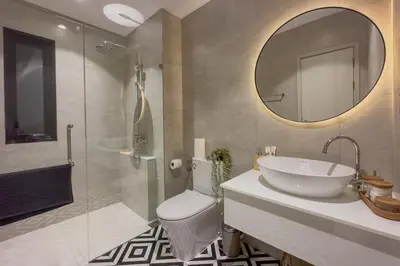 a bathroom with a sink and a toilet and a mirror at TheTitleHalo1 in Phuket