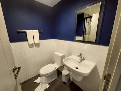 a bathroom with a white toilet and a sink at The Base Central Phuket-B32YJ in Ban Rangeng