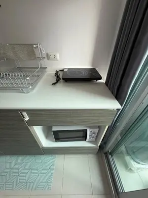a laptop sitting on a shelf in a room at dcondo Mine Phuket in Kathu