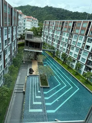 an overhead view of a swimming pool in an apartment building at dcondo Mine Phuket in Kathu