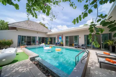 a swimming pool in the backyard of a house at Bang tao modern holiday style pool view high speed WiFi in Laguna Phuket