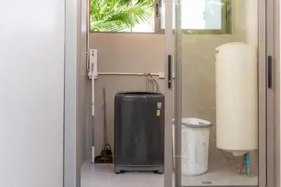 a door to a bathroom with a trash can at Bang tao modern holiday style pool view high speed WiFi in Laguna Phuket