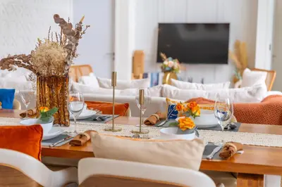 a dining room with a table and a couch at \u4e91\u6816\u522b\u9662 Cloudrest Villa in Phuket Town