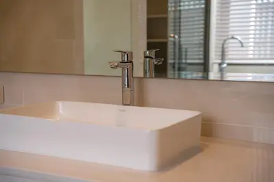 a white sink in a bathroom with a mirror at Modern Minimalist 6 Bedroom Light Luxury Villa Private Pool Golf Course Laguna Park in Bang Tao Beach