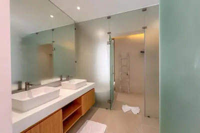a bathroom with two sinks and a shower at Brand-New 3BR Designer Pool Villa in Exclusive Residence LuxPride 4 L20 in Bang Tao Beach
