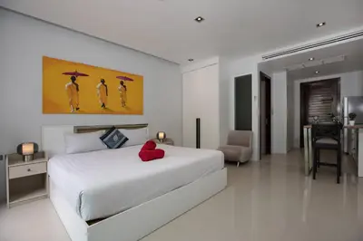 a bedroom with a bed with a red stuffed animal on it at Tropical Retreat near Patong - Emerald Hill 420 in Patong Beach