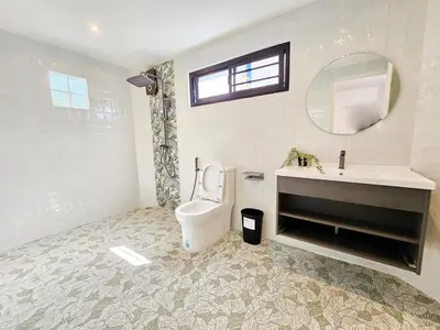 a bathroom with a toilet and a sink and a mirror at Modern 2 Bedroom Pool Villa in Kamala in Kamala Beach