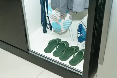 a group of green shoes in a display window at Beachfront Deluxe BR Infinity Pool Patong Phuket in Patong Beach