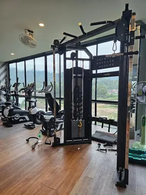 a gym with a bunch of treadmills and machines at La Vita Rawai 1 Bdr Roof Pool in Rawai Beach