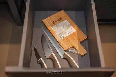 a pair of knives sitting in a drawer at CityGate Kamala 1BR 3 min Beach in Kamala Beach