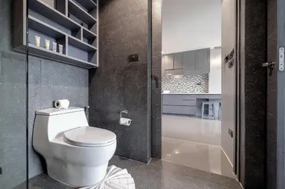 a bathroom with a toilet and a glass door at Tropical & Modern Living - Hill View Tropics Kamala Suite CTG L707, Top Amenities & Beach Fun in Kamala Beach