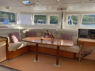 a small table in the middle of a boat with a table at Catamaran Lagoon 440 Calypso in Ban Bang Chak
