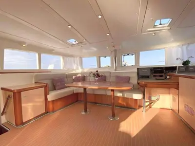 a kitchen and a table in the middle of a boat at Catamaran Lagoon 440 Calypso in Ban Bang Chak