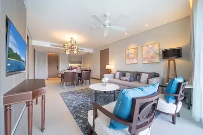 a living room with a couch and a table at Angsana Oceanview Residence Luxurious 2BR Lakeview Apartment in Laguna Phuket