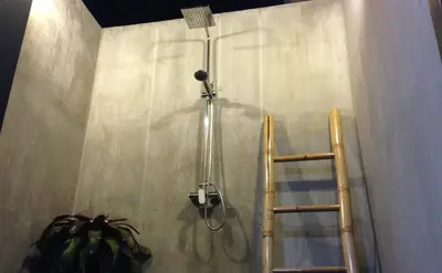 a shower with a ladder and a shower curtain at Baan Norkna Bangtao in Bang Tao Beach