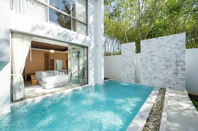 a swimming pool in the backyard of a house at Luxpride 3BR near laguna friendly villa with Garden&pool in Ban Pak Lak