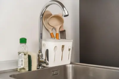 a kitchen sink with a kitchen utensils in a holder at C210 Peaceful Retreat in Heart of Phuket in Kathu