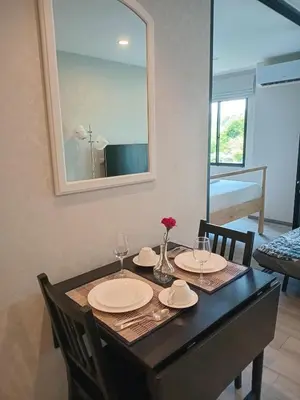a dining room table with two chairs and a mirror at В11 Title Naiyang Ватсап669З5В2I976 in Nai Yang Beach
