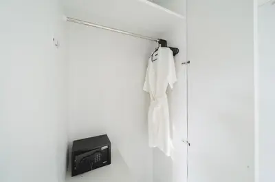 a towel rack with a tv on a wall at Laguna Townhouse with private pool and your own gym near Bangtao Beach in Laguna Phuket