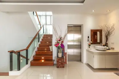 a bathroom with a sink and a stairway with a sink at V210 Retreat 3BR Top of the Range, Sea View,Lift in Rawai Beach