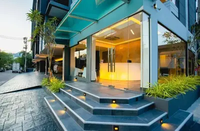 a house with a staircase in front of it at C212 Relaxing Condo Rooftop Pool & Ocean Views in Chalong