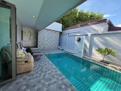 a swimming pool in the middle of a house at Quiet Harbor in Ban Saiyuan (1)