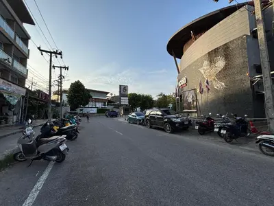 a group of motorcycles parked on the side of a street at Aqua Inn Ao Nang in Ao Nang Beach