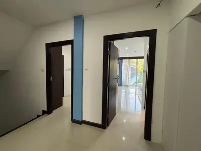 two doors in a room with a hallway at Aqua Inn Ao Nang in Ao Nang Beach