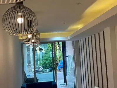 two lights hanging from the ceiling in a room at Aqua Inn Ao Nang in Ao Nang Beach