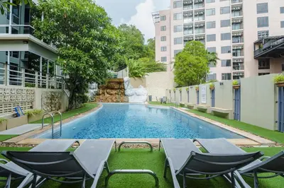 a swimming pool in the middle of a building at Karon View 2 Bed 5 Minutes walk to Karon Beach 11 in Karon Beach