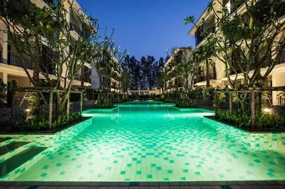 a swimming pool in the middle of a building at Room in Rawai in Rawai Beach