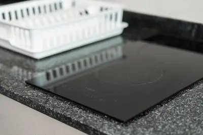 a close up of a black counter top with a plastic container at C209 Surin Beachside Sun Escape & Infinity Pool in Surin Beach