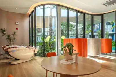 a living room with a table and a tub at C213 Fit Chill Condo with Pool and Gym in Kathu
