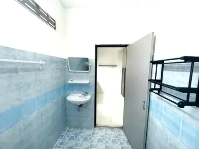 a small bathroom with a sink and a toilet at Patong Canal Villa 104 in Patong Beach