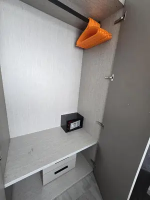 a room with a shelf with a clock and an orange box at Modern Retreat 1- BedT3-529 in Chalong