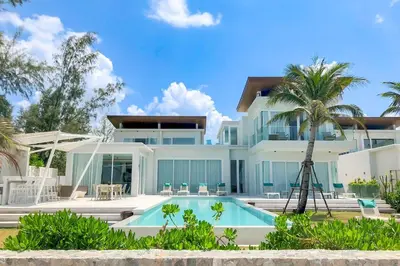 a house with a swimming pool in front of it at Baan Kloi in Ban Na Tai