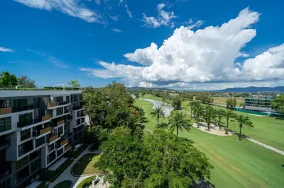 an aerial view of a building and a golf course at Skypark Laguna Bang Tao Beach in Laguna Phuket