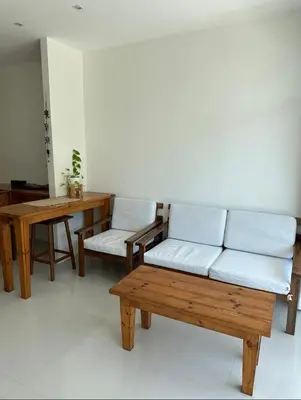 a living room with a couch and a table at Grand kamala falls in Kamala Beach
