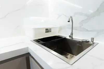 a kitchen sink in a white counter top at Suite Coral 2BR Pool AccessReLife Nai Harn in Phuket Town